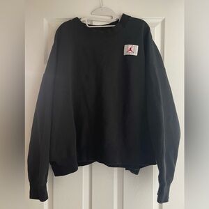 Jordan Black Crewneck Sweatshirt with Red Jumpman Patch